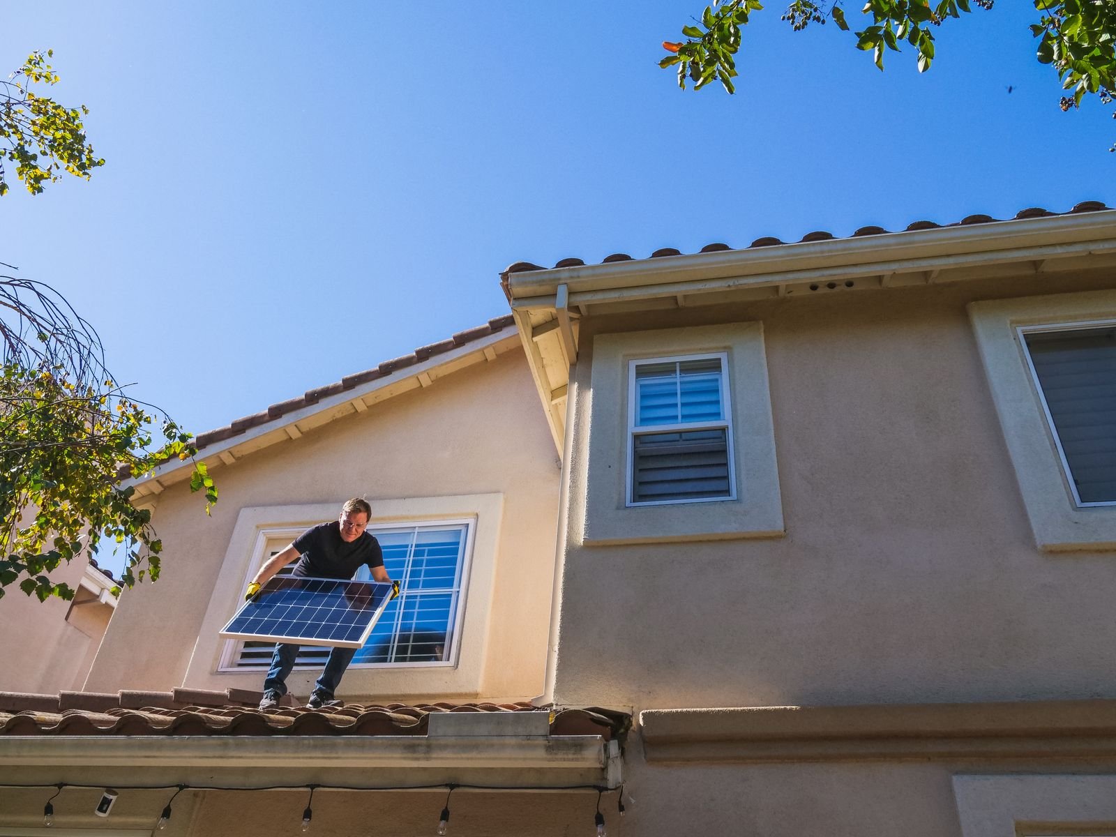 Solar Panel Installer on Rooftop